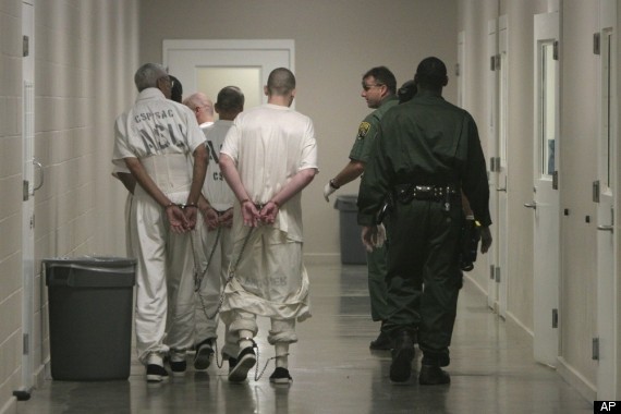 inmates walking down a hall